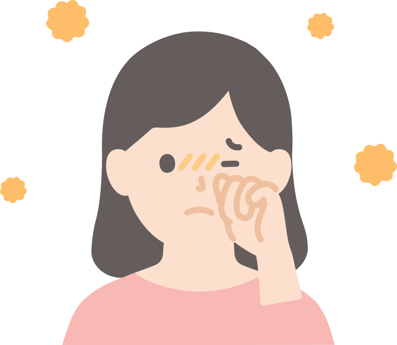 目をこすっている花粉症の女性